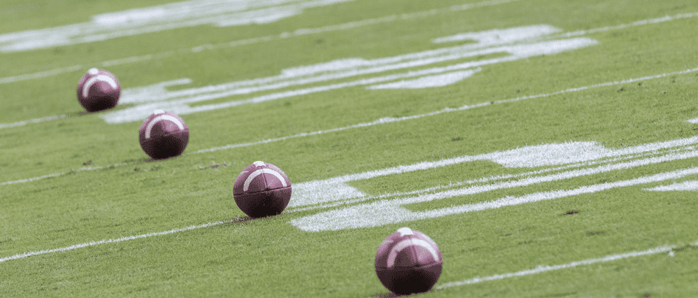 College Footballs Lined Up