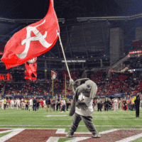 Alabama Football team mascot waves flag
