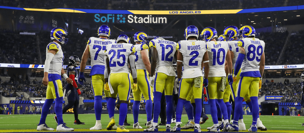 Los Angeles Rams huddle for play