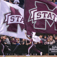 Mississippi State Football cheer team runs on field