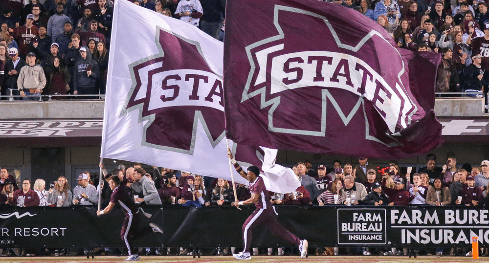 Mississippi State Football cheer team runs on field