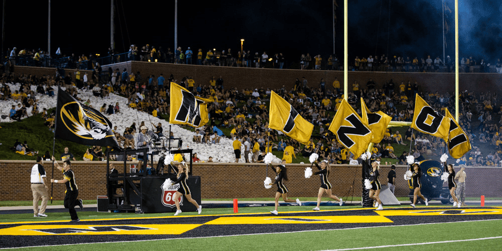 Missouri Football cheer team runs on field