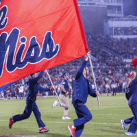 Ole Miss Football cheer team runs on field