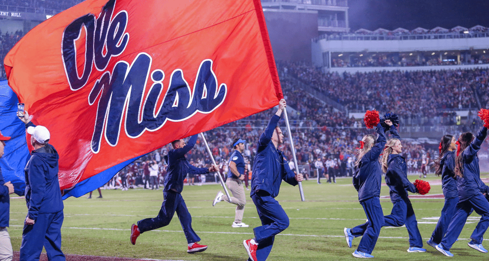 Ole Miss Football cheer team runs on field