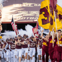 Minnesota Golden Gophers Football runs on field