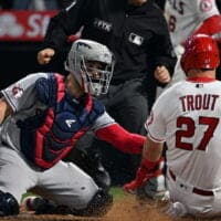 Mike Trout of Angels slides into home plate for a NRFI