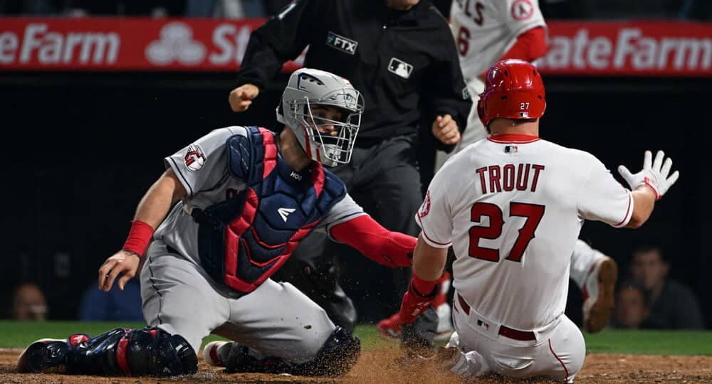 Mike Trout of Angels slides into home plate for a NRFI