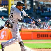 White Sox Player Hits Baseball