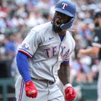 Adolis Garcia of Rangers celebrates home run