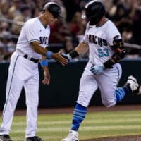 Christian Walker of Diamondbacks rounds bases after hitting home run