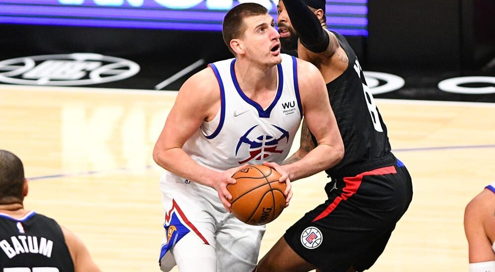 Nikola Jokic of Nuggets attempts to pass NBA Player Props