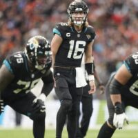 Trevor Lawrence of Jaguars attempts to pass NFL football