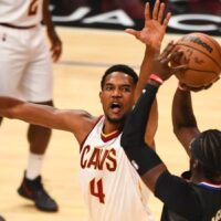 Evan Mobley of Cleveland Cavaliers defends shot