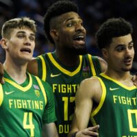 Oregon players gather after play