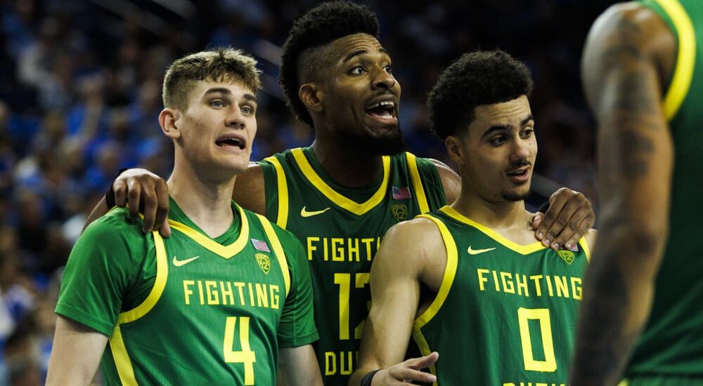 Oregon players gather after play