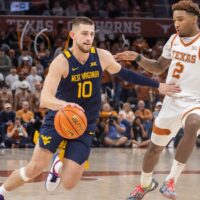 West Virginia player drives basket