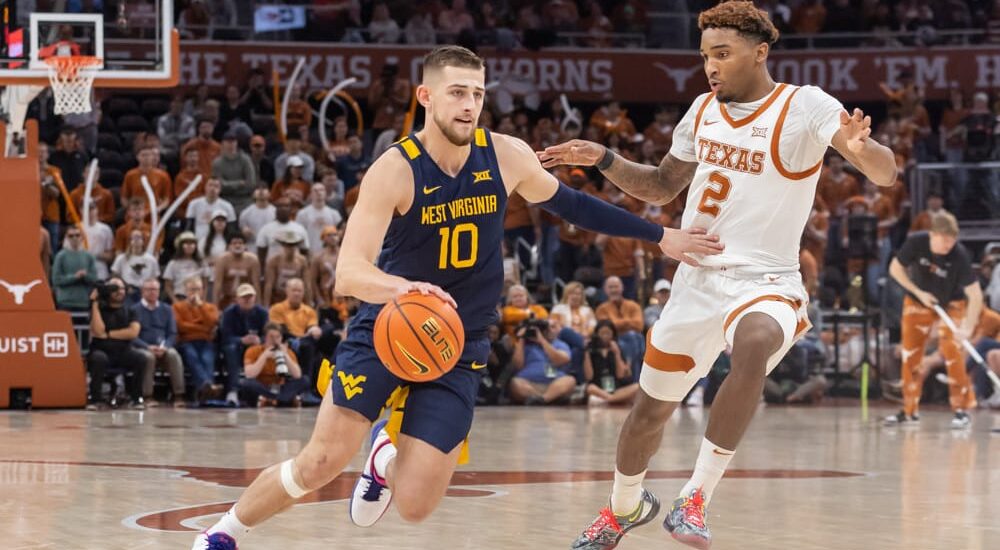 West Virginia player drives basket