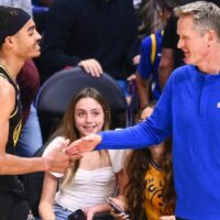 Golden State Warriors player shakes coach's hand