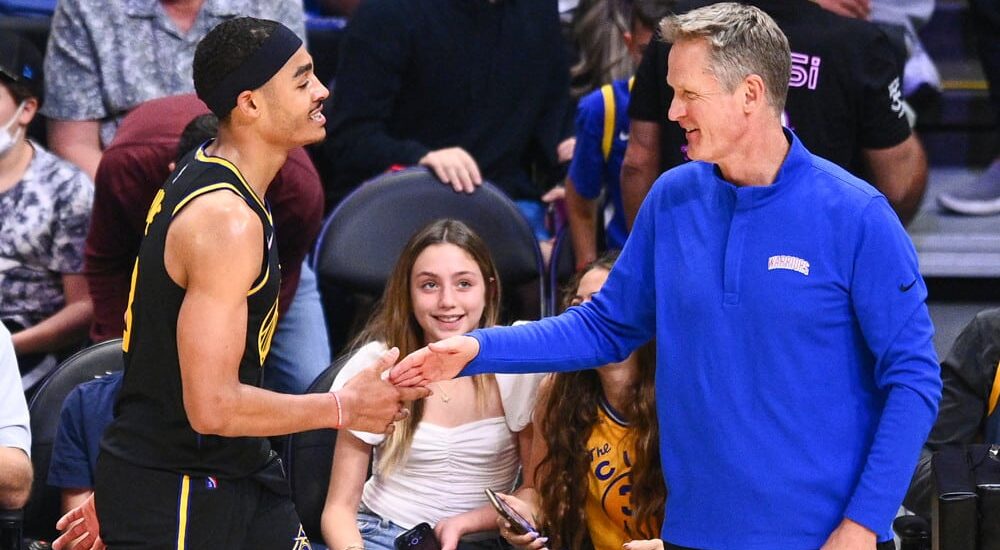 Golden State Warriors player shakes coach's hand