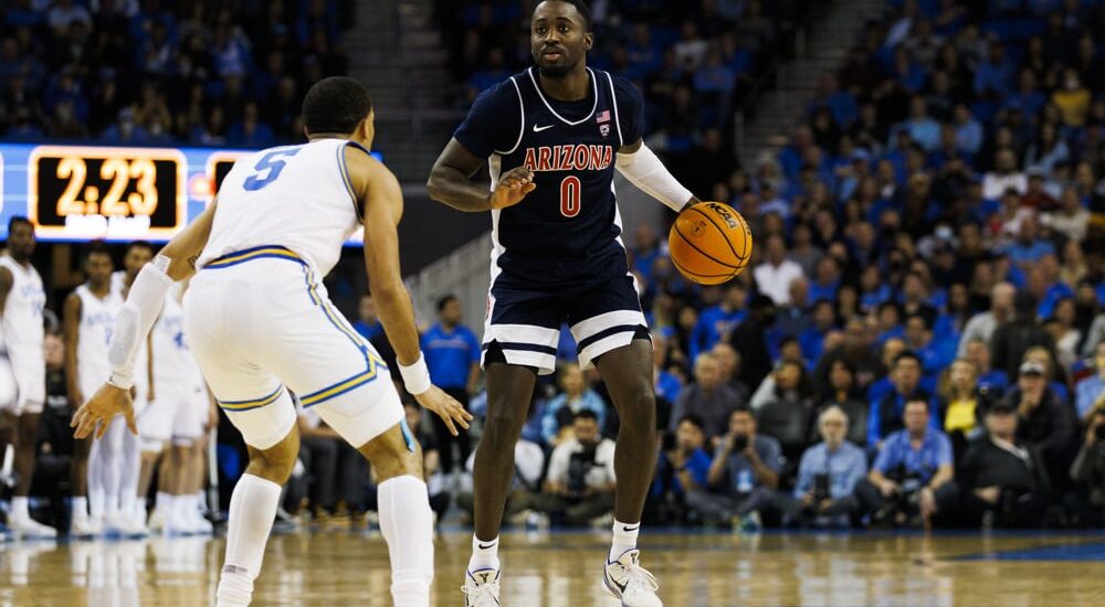 Arizona Wildcats player dribbles basketball