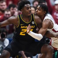 Missouri player dribbles ball in paint