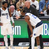 Kyrie Irving talks with teammate