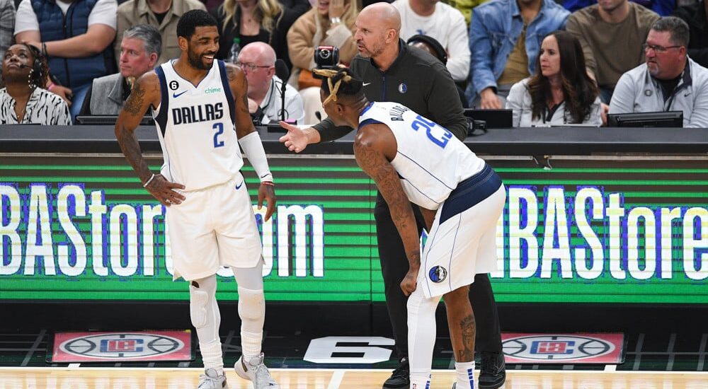 Kyrie Irving talks with teammate