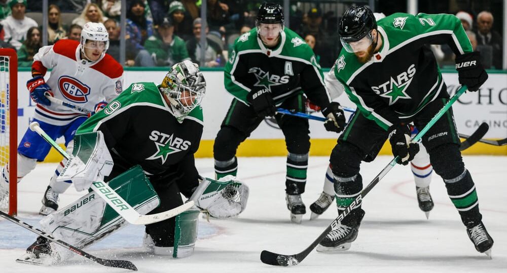 Dallas Stars player controls puck