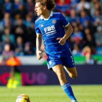 Leicester City player dribbles soccer ball