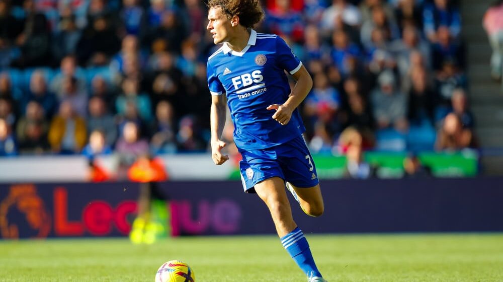 Leicester City player dribbles soccer ball