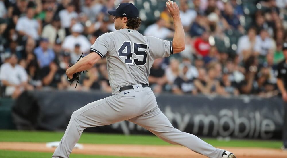 Gerrit Cole of Yankees pitches baseball in first inning