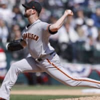 Alex Wood of Giants pitches baseball