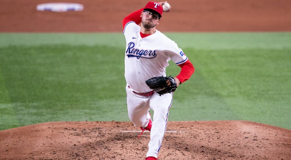 Dane Dunning of Rangers pitches baseball