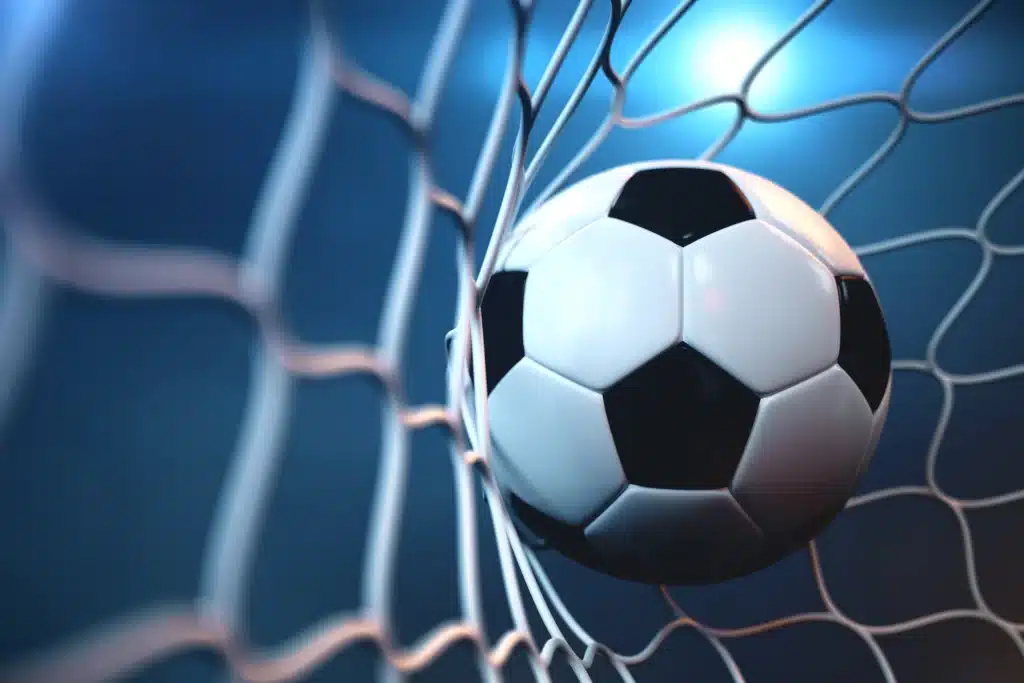 soccer ball in net with spotlight or stadium light background free photo
