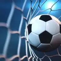 soccer ball in net with spotlight or stadium light background free photo