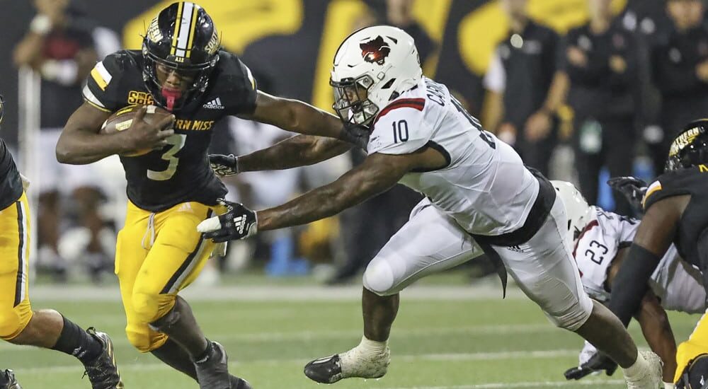 Frank Gore Jr. of Southern Miss runs past defender