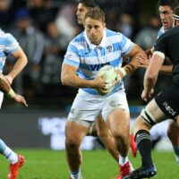 Argentina rugby player runs with ball