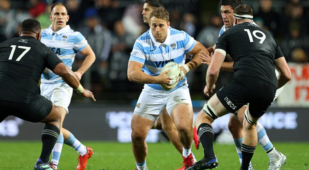 Argentina rugby player runs with ball