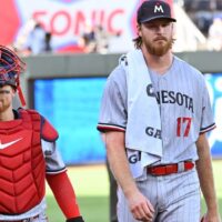 Pitcher Bailey Ober walks with catcher after game