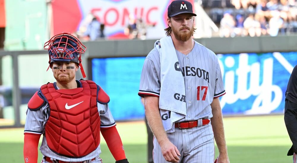 Pitcher Bailey Ober walks with catcher after game