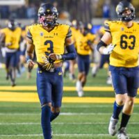 Cal Football players warm up before game