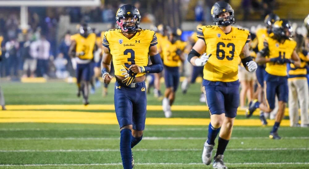 Cal Football players warm up before game