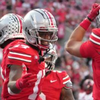 Ohio State football players celebrate after play