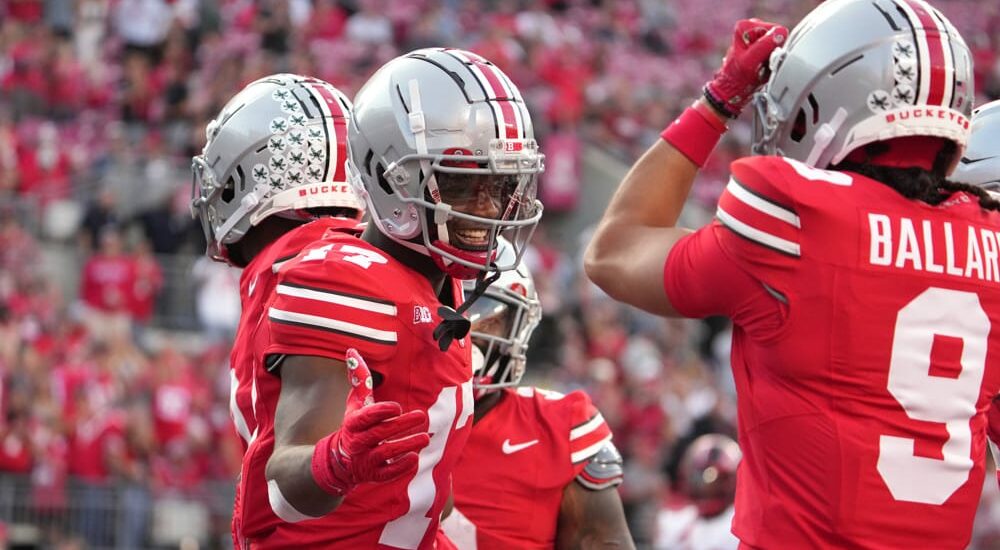 Ohio State football players celebrate after play